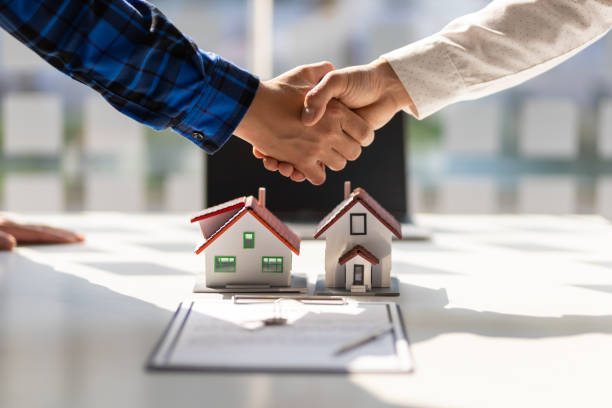 image represents a goal of shaking hands and forming a professional relationship with a realtor to sell a home